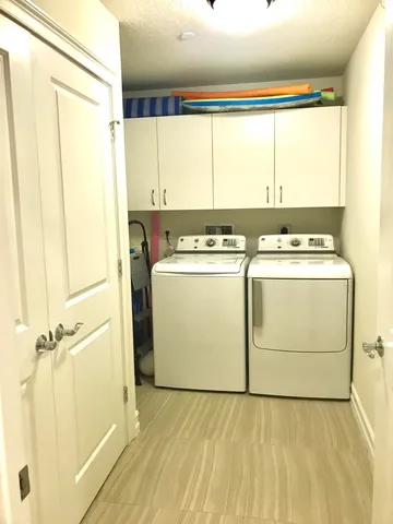 an aerial view of residential houses with outdoor space and river