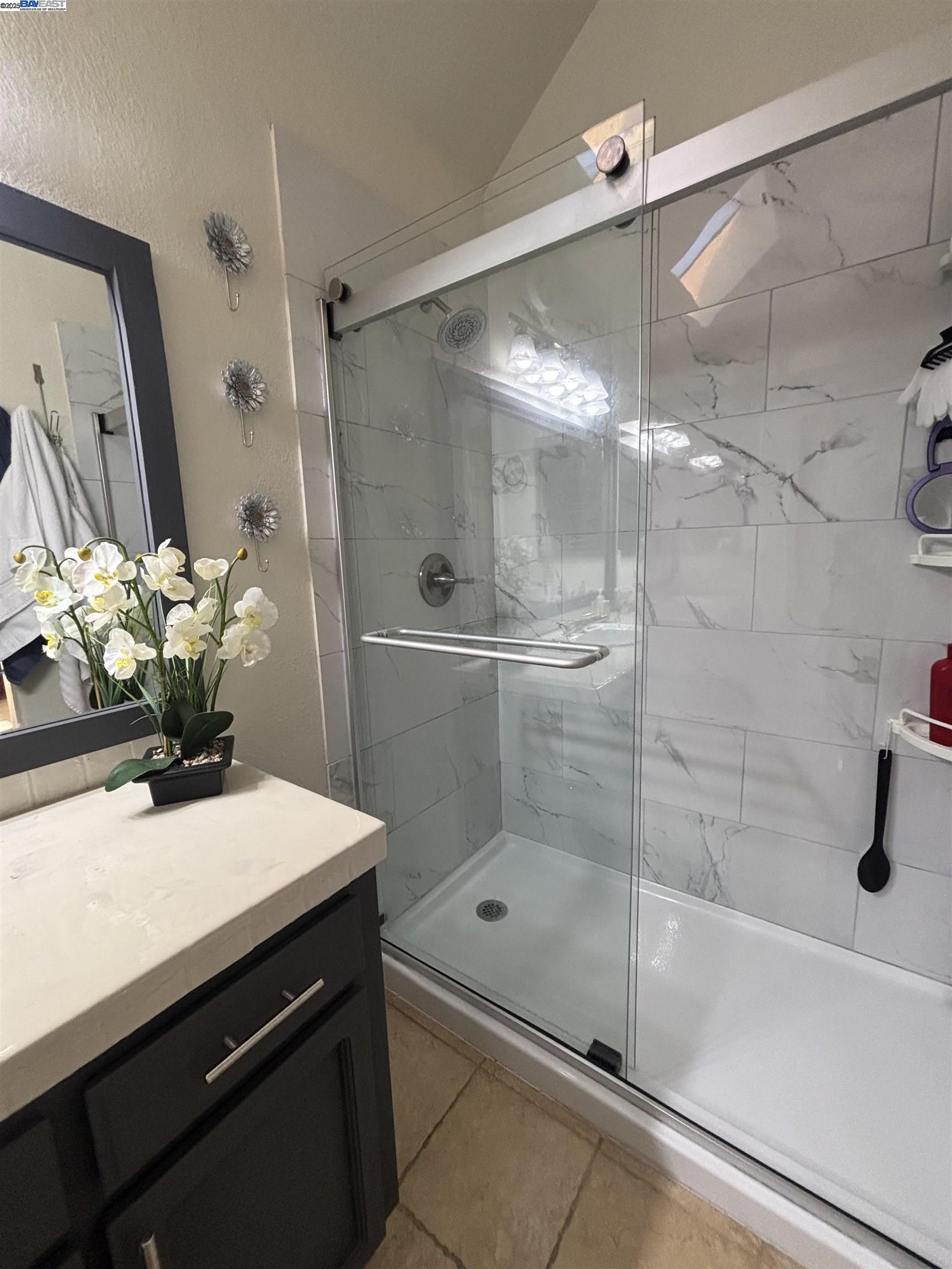 7 Cliff Walk Drive Vallejo, CA 94591 - Photo 14 of 20 a bathroom with a sink mirror and a shower