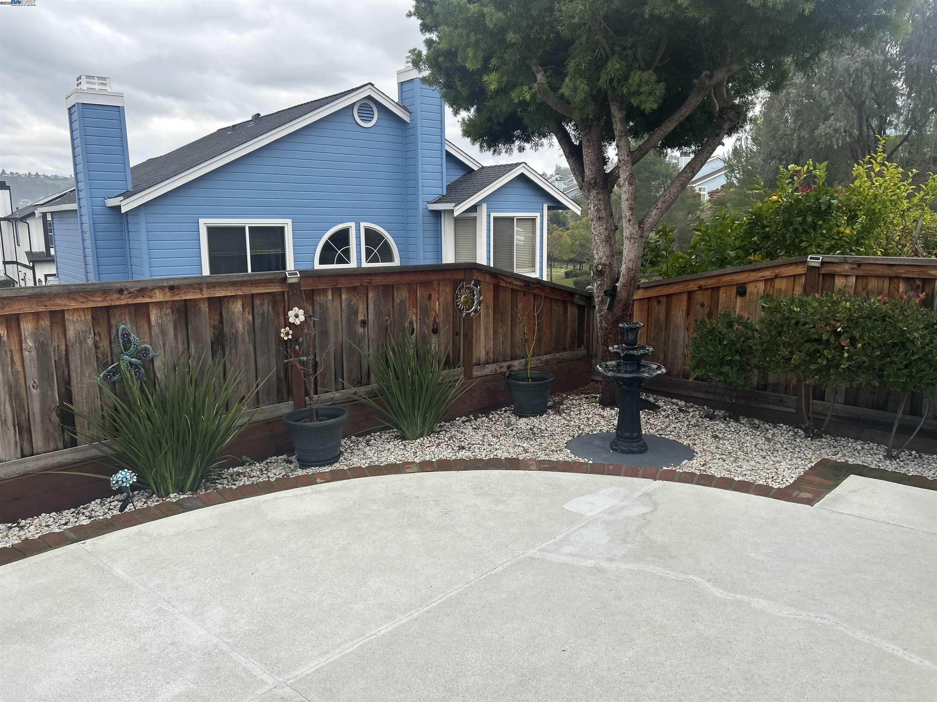 7 Cliff Walk Drive Vallejo, CA 94591 - Photo 16 of 20 a front view of a house with a yard and potted plants