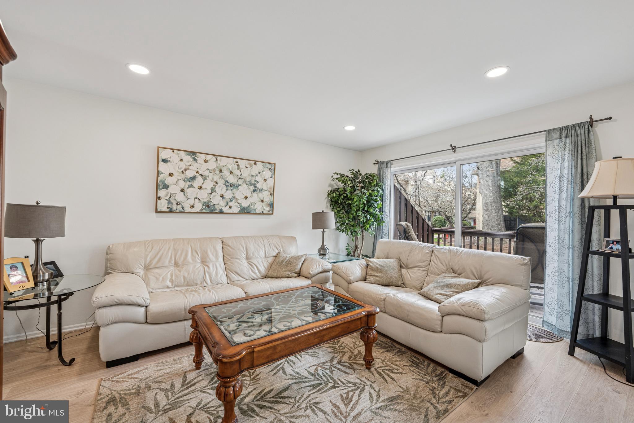 7 Chateau Circle, Unit 23 Chesterbrook, PA 19087 - Photo 10 of 23 Living room with slider to the back deck