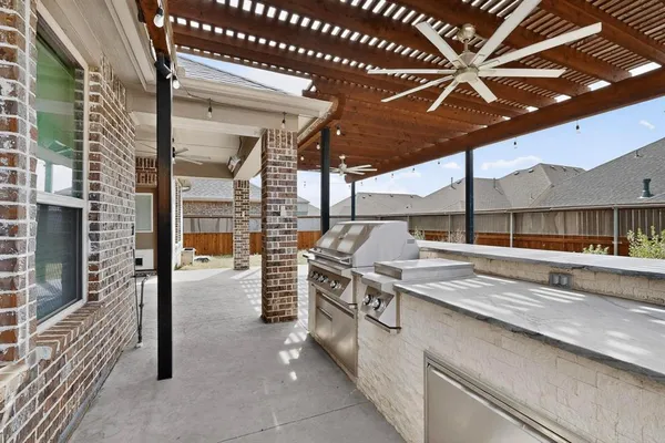 a view of a hall with a sink and wooden floor