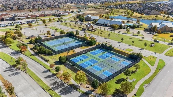 an aerial view of a pool table and chairs