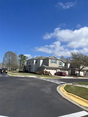 a view of building with car parked