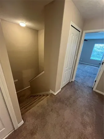 an empty room with a fireplace