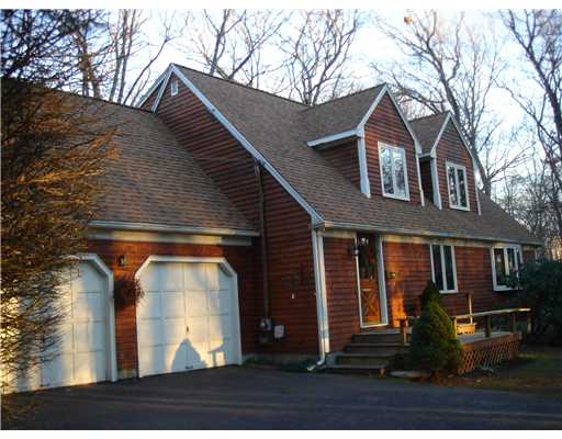 Exterior Front. Natural grain wood clapboard siding, All new Pella 850 Energy Star casement wood interior/alum exterior windows