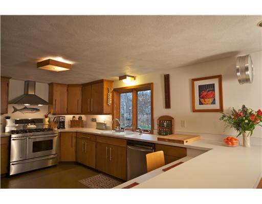 55 Linden Road Barrington, RI 02806 - Photo 2 of 12 Kitchen. Great Room with two story chimney/woodstove blends seamlessly with dining area, chef s kitchen and eat-at-counter area