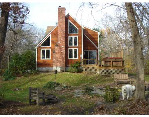 55 Linden Road Barrington, RI 02806 - Photo 7 of 12 Exterior Back. Deep side & backyard entertainment fun featuring a koy pond, fire circle & hot tub w/deck just off greatroom through sider-doorway