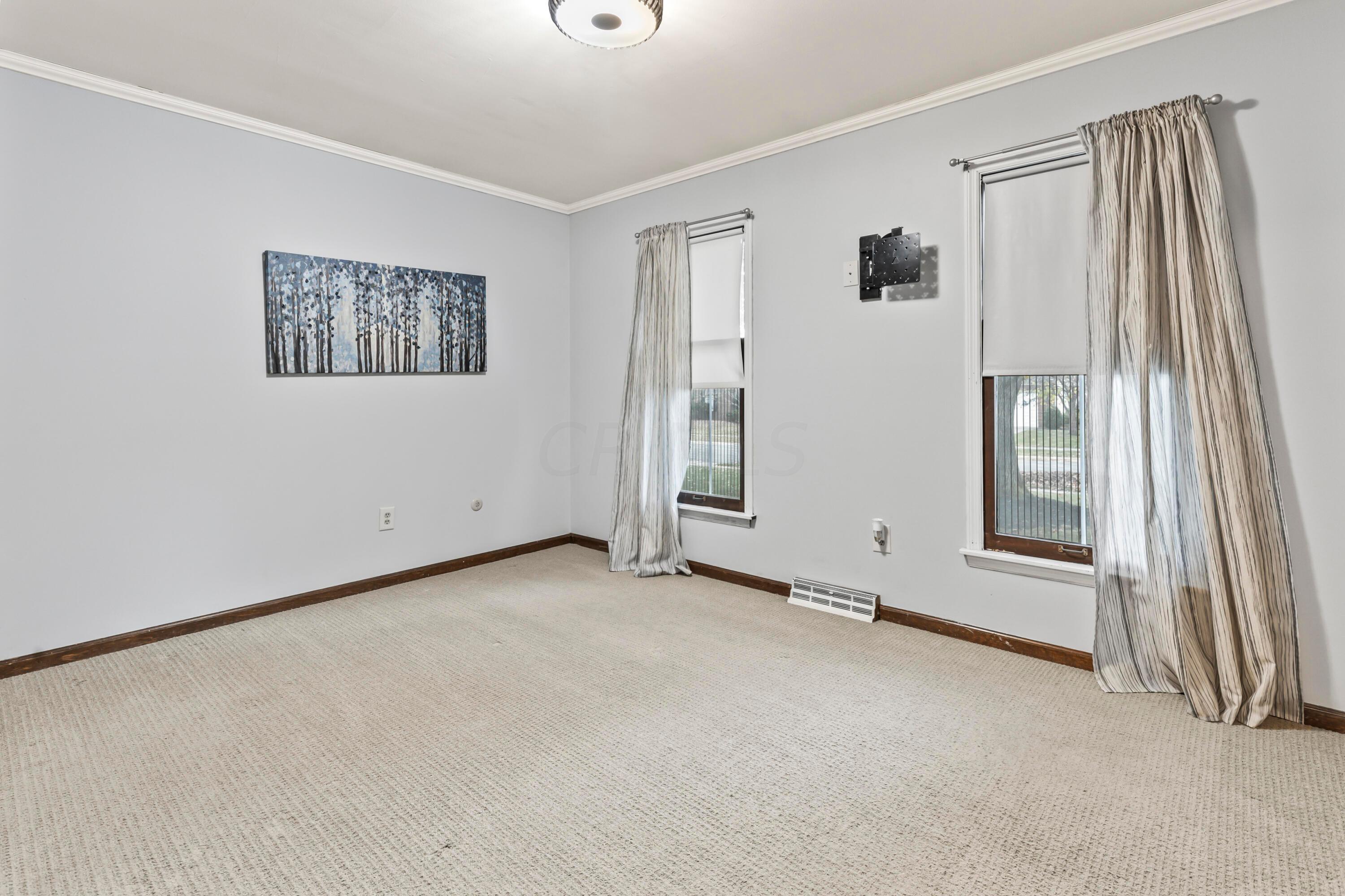 7020 Rieber Street Columbus, OH 43085 - Photo 31 of 40 • Berber carpet • Blue/grey painted walls • New ceiling light ~ 2017 • Drapes are negotiable • Closet with double sliding doors