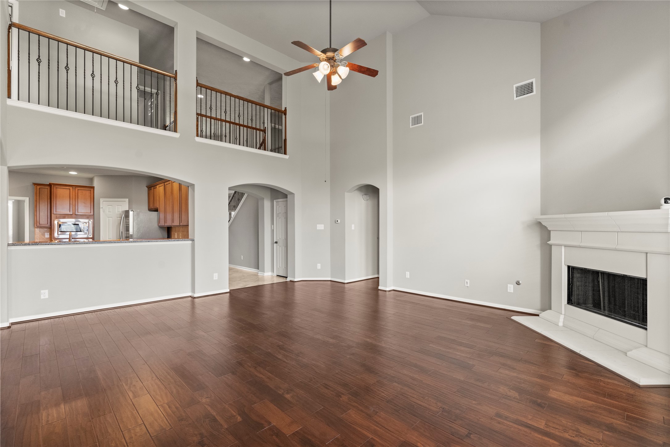 5307 Amber Sky Lane Rosharon, TX 77583 - Photo 11 of 44 a view of an empty room with window and wooden floor