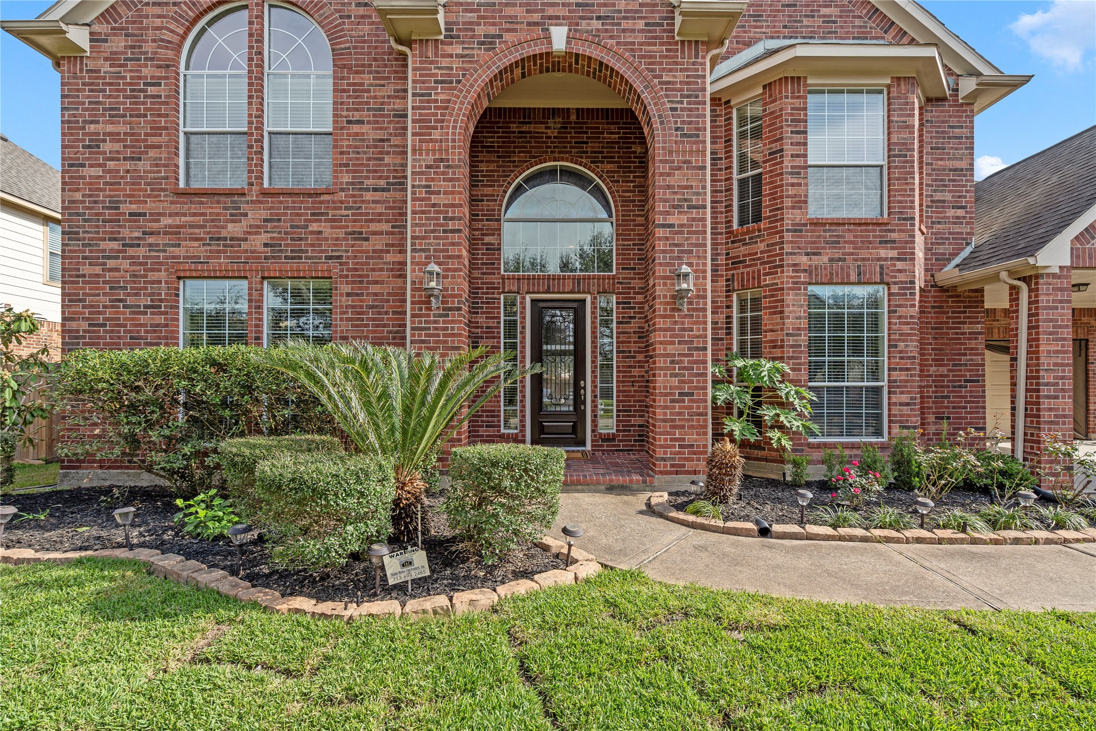 5307 Amber Sky Lane Rosharon, TX 77583 - Photo 3 of 44 a front view of a house with yard and glass windows