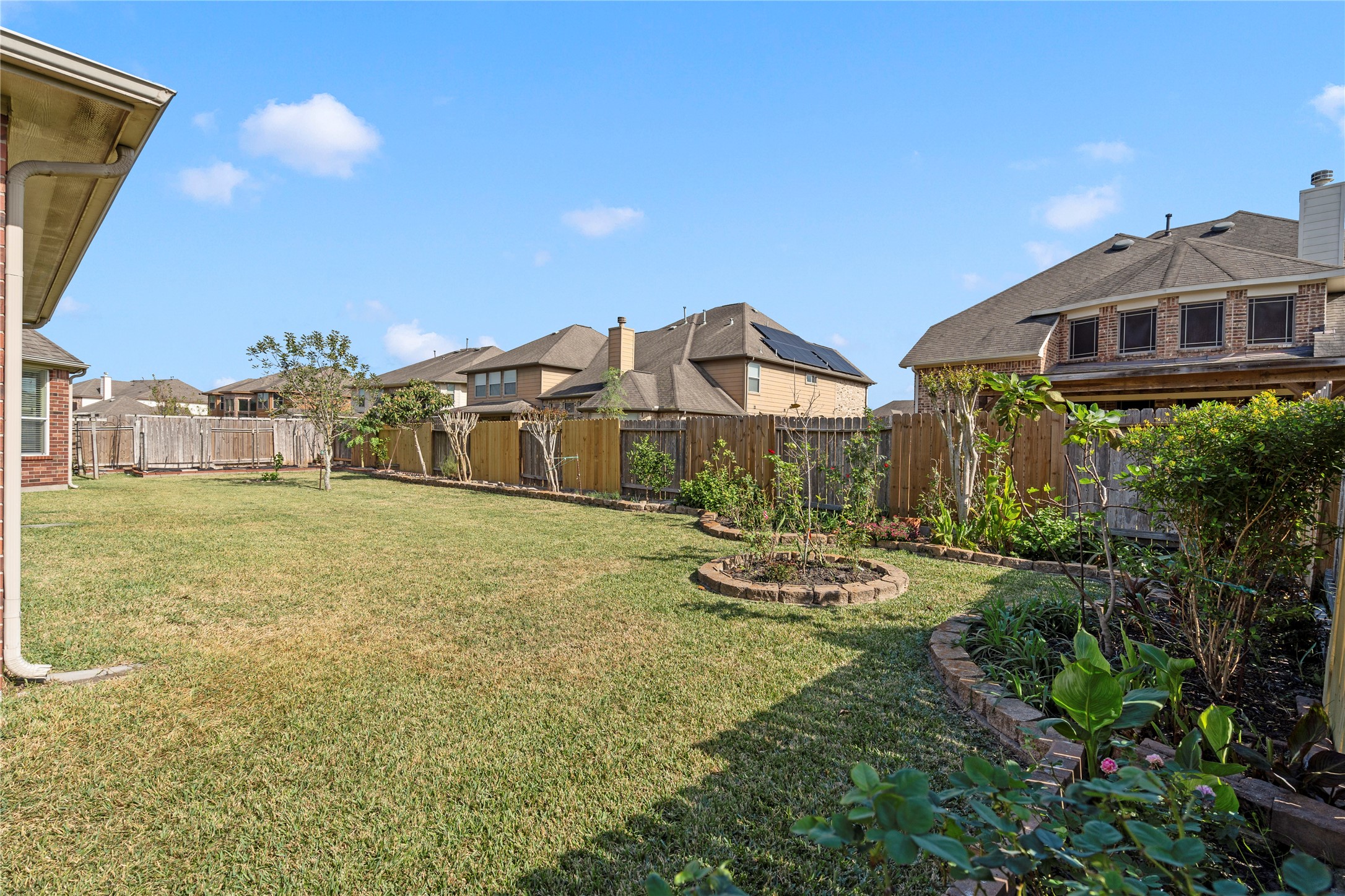 5307 Amber Sky Lane Rosharon, TX 77583 - Photo 44 of 44 a view of a big house with a big yard and large trees