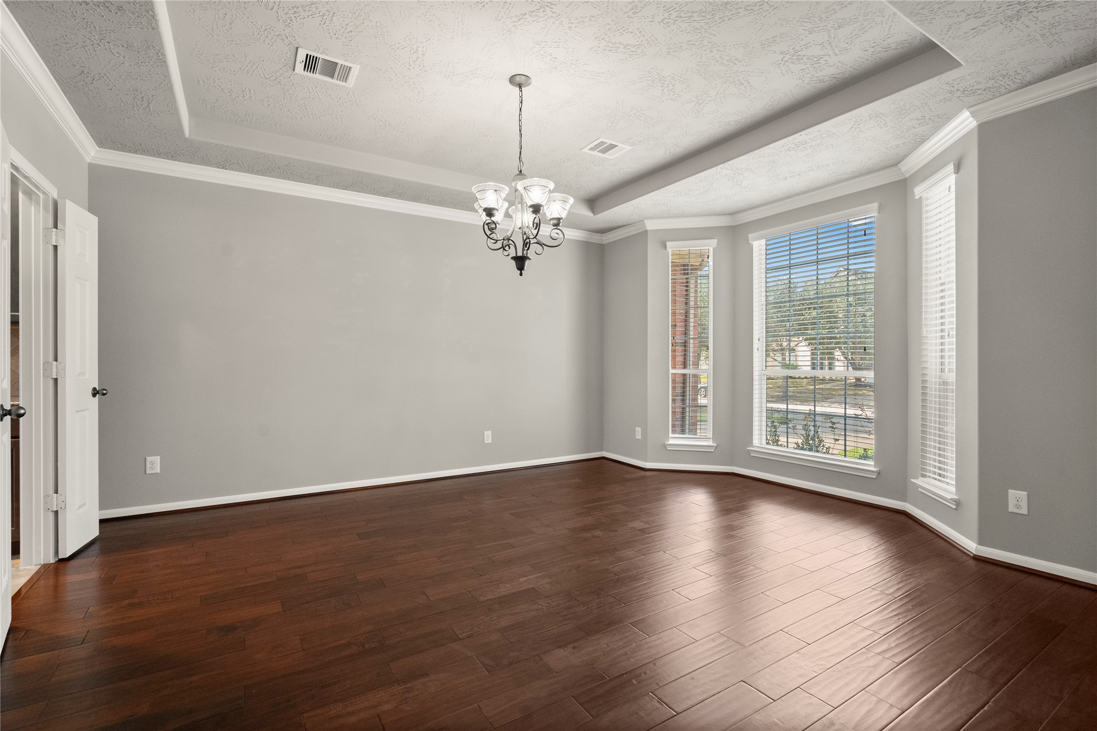5307 Amber Sky Lane Rosharon, TX 77583 - Photo 7 of 44 a view of livingroom with window wooden floor and chandelier