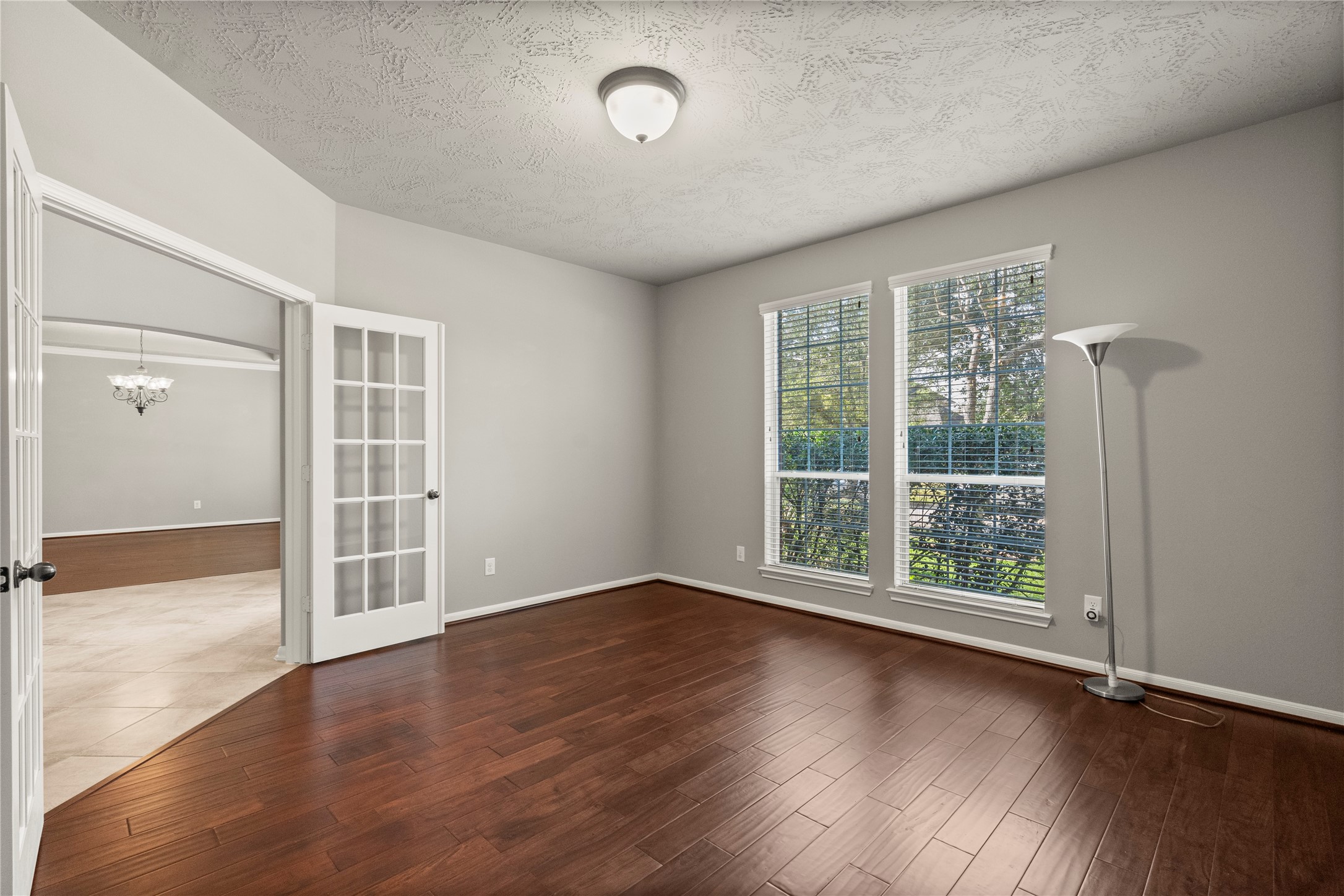 5307 Amber Sky Lane Rosharon, TX 77583 - Photo 9 of 44 an empty room with wooden floor and windows