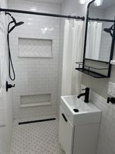 588 South Minter Street Stephenville, TX 76401 - Photo 10 of 12 a bathroom with a sink and a shower