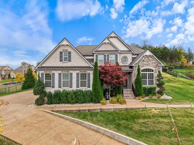 a view of a livingroom with wooden floor and furniture