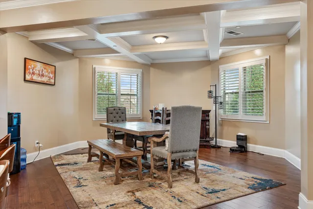 an aerial view of residential houses with outdoor space and city view