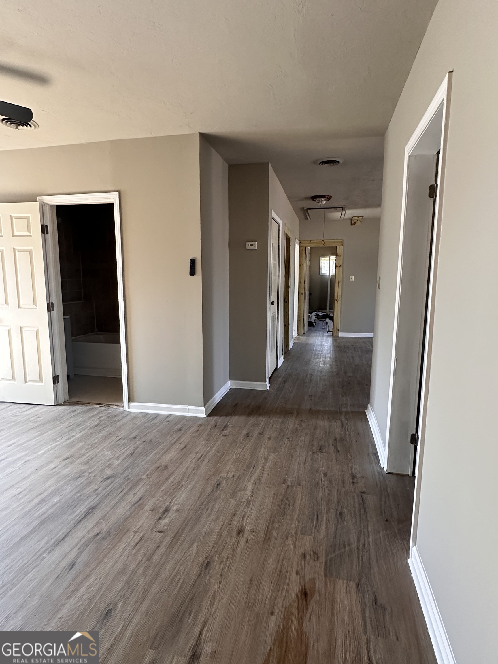 481 Main Street Clermont, GA 30527 - Photo 14 of 43 wooden floor in a hall with an entryway