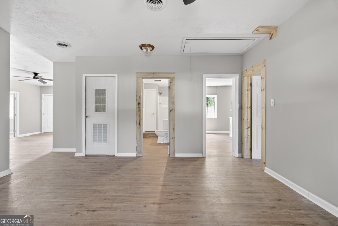 481 Main Street Clermont, GA 30527 - Photo 23 of 43 a view of a hallway with wooden floor