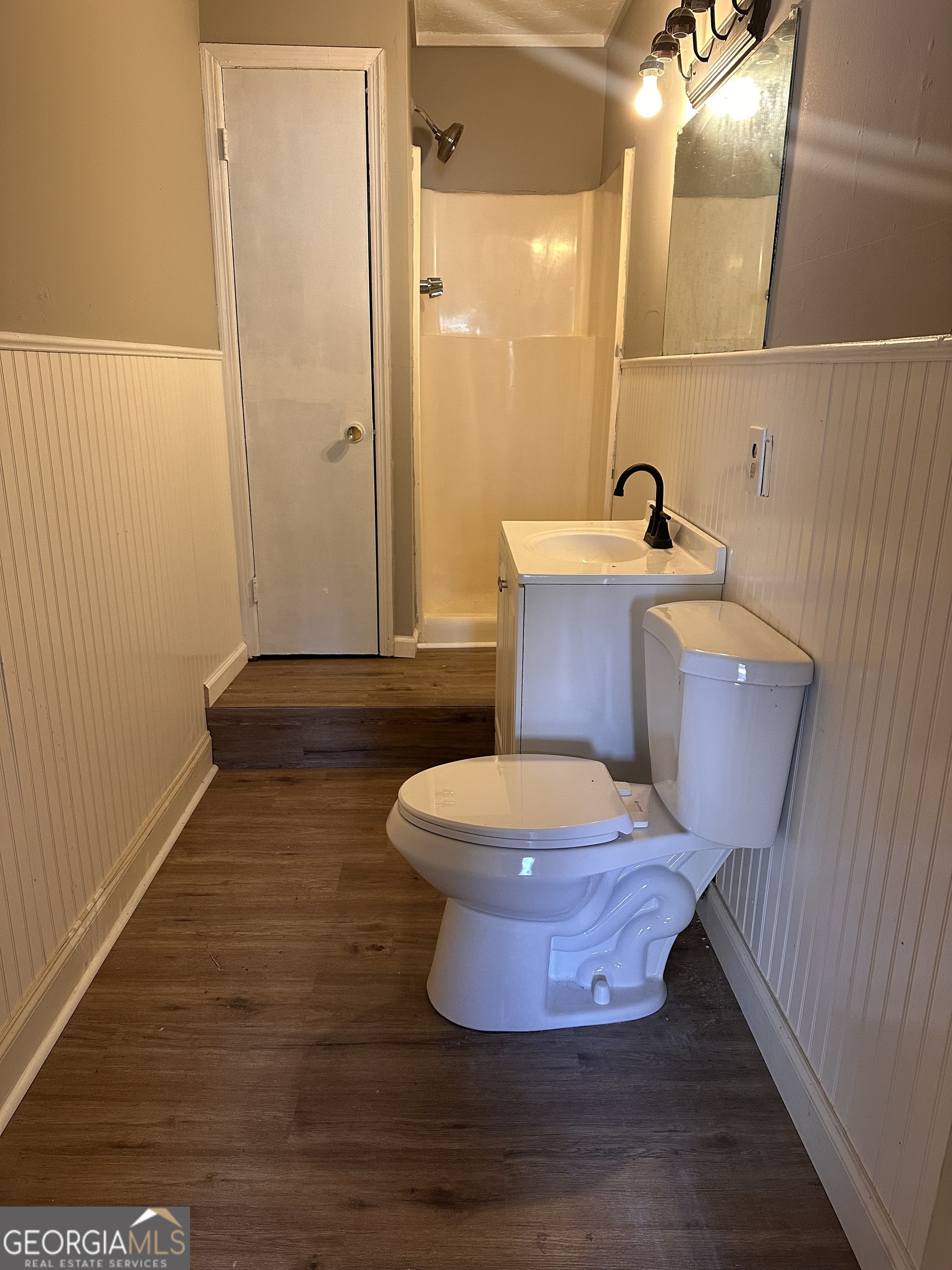 481 Main Street Clermont, GA 30527 - Photo 24 of 43 a bathroom with a sink and a mirror