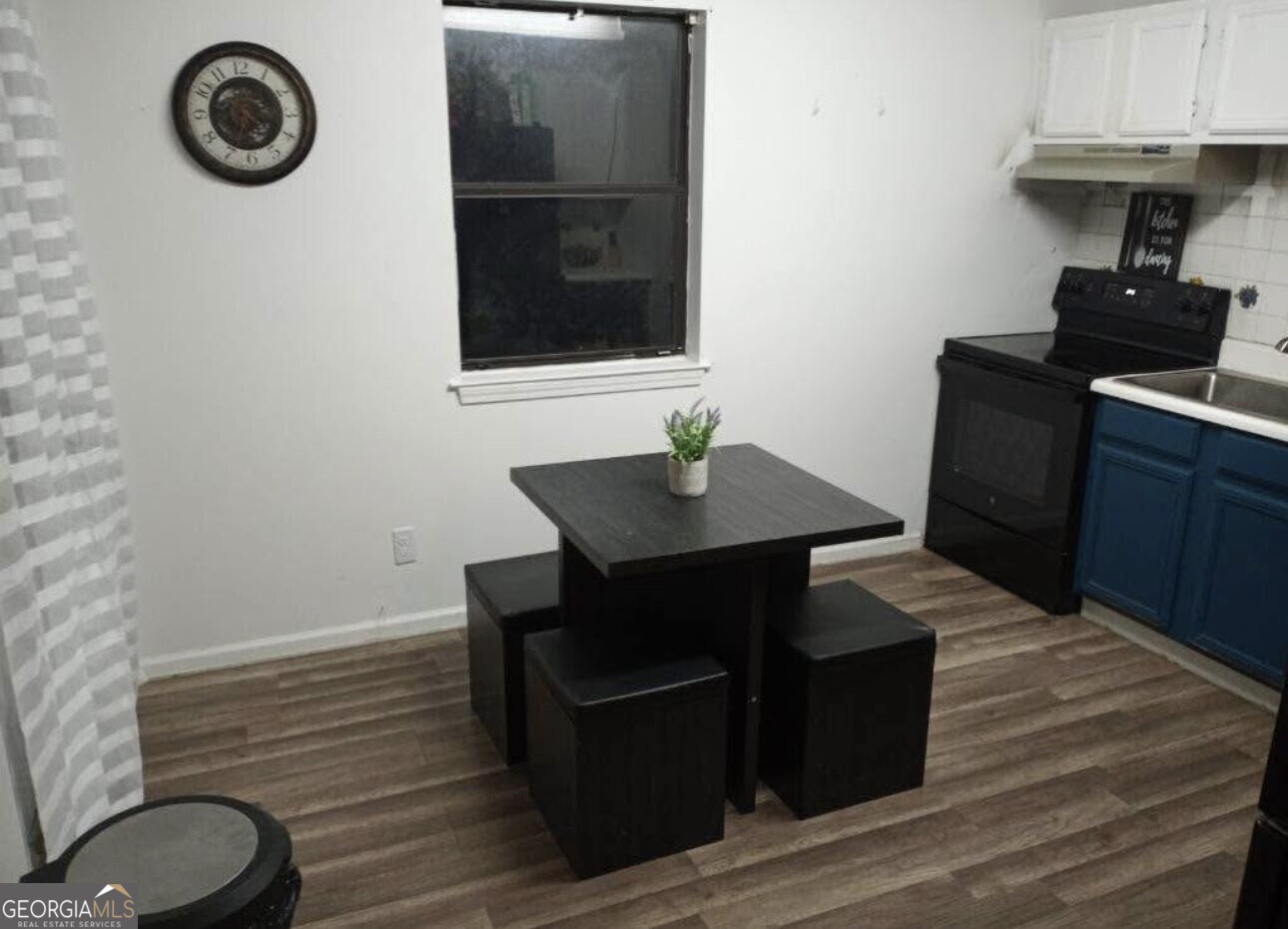481 Main Street Clermont, GA 30527 - Photo 26 of 43 a view of a workspace area with wooden floor