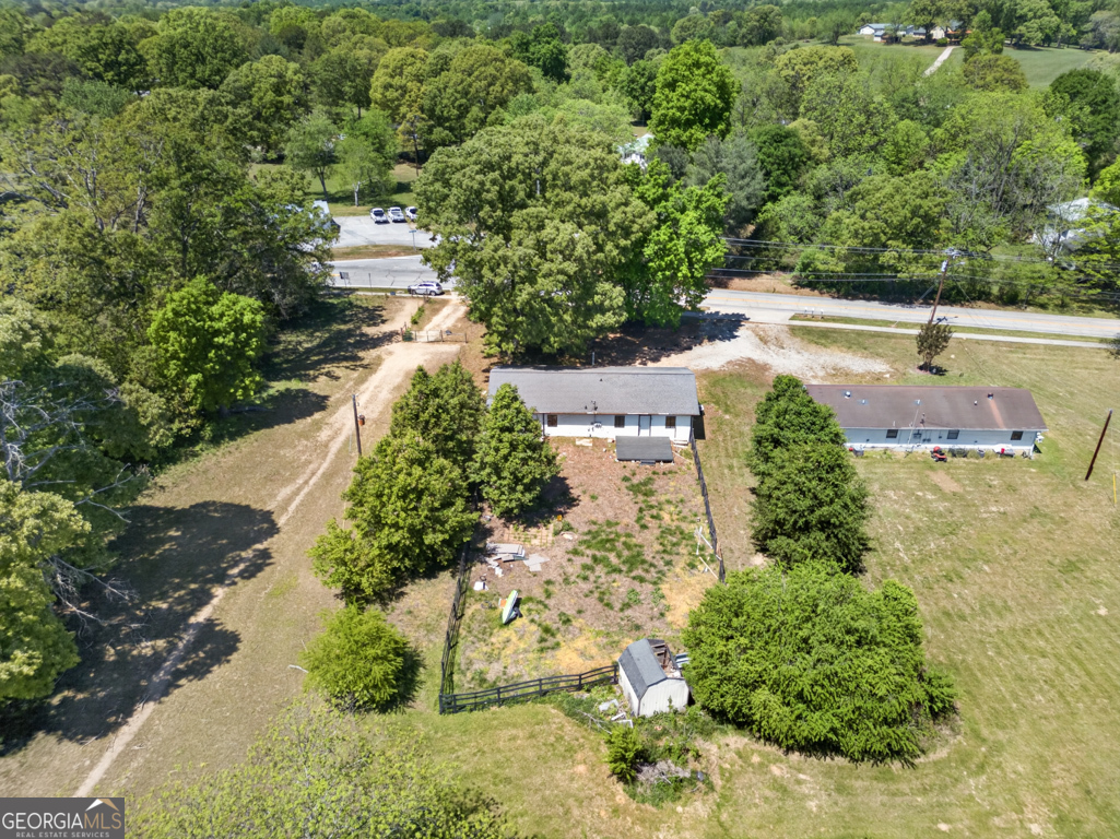 481 Main Street Clermont, GA 30527 - Photo 5 of 43 an aerial view of a house with a yard and lake view