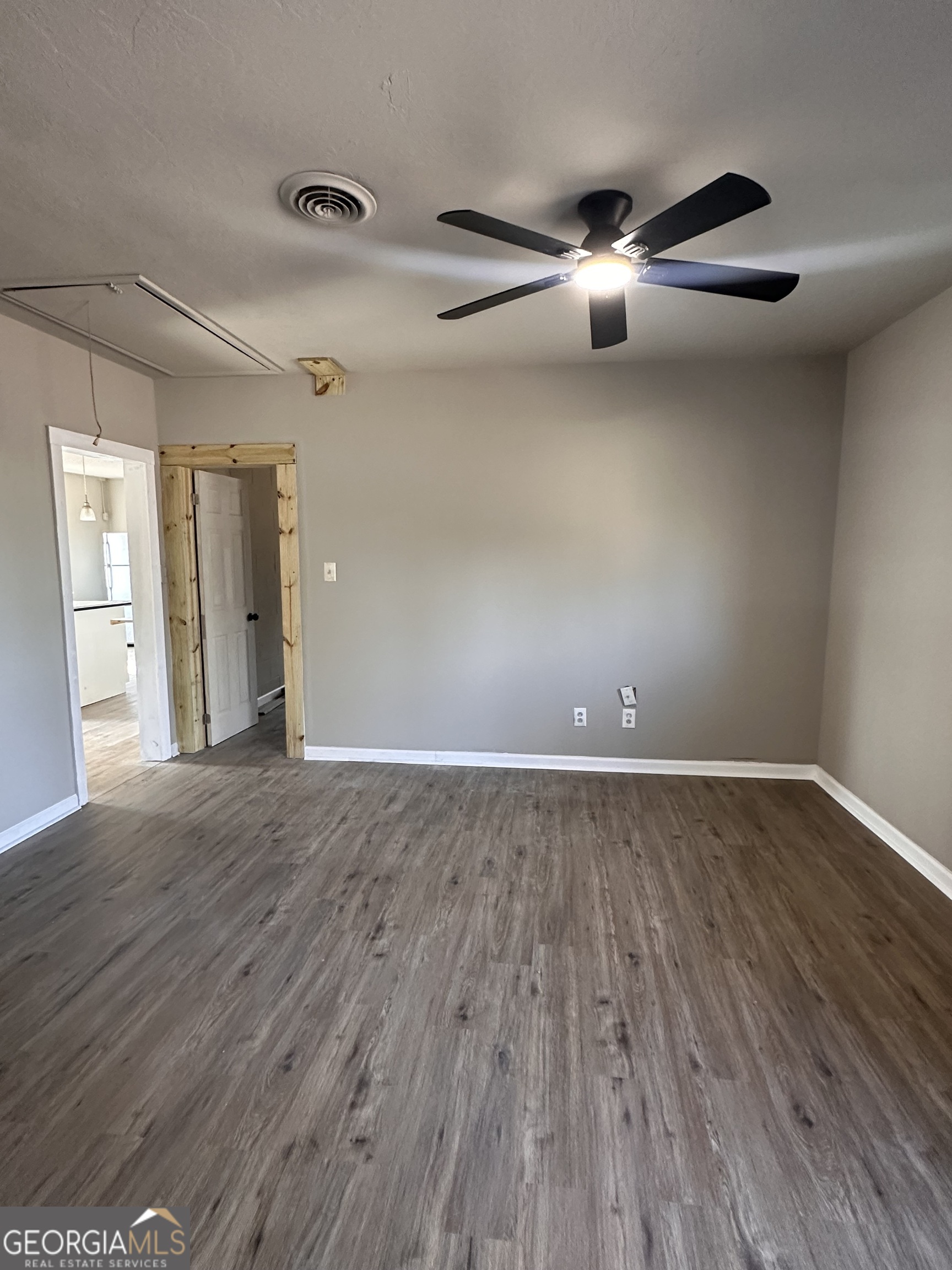 481 Main Street Clermont, GA 30527 - Photo 10 of 43 wooden floor in an empty room