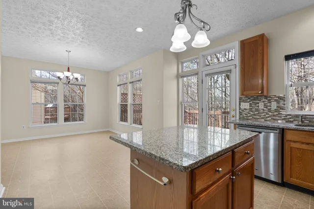a view of a kitchen with appliances