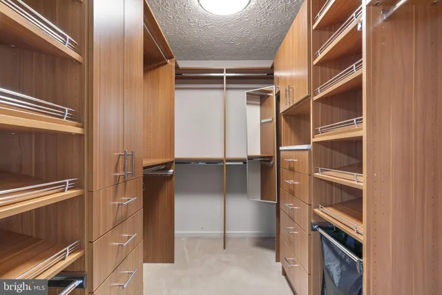 a bathroom with a granite countertop sink a toilet and a mirror