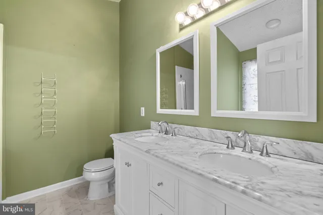 a bathroom with a bathtub a shower and a sink