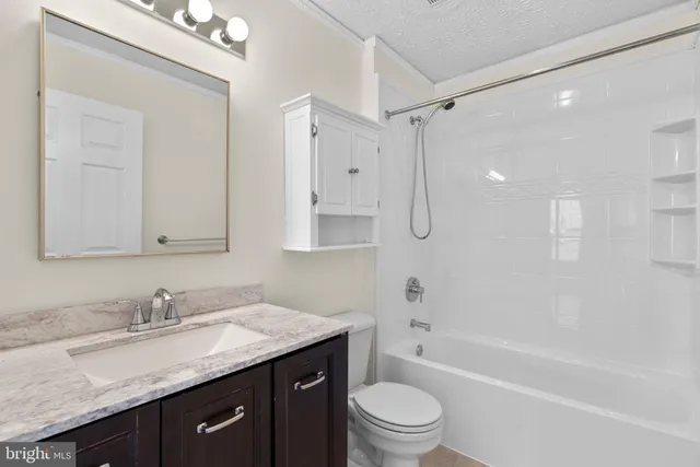 a view of an empty room with a fan