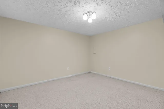 a view of deck with wooden floor and fence and trees