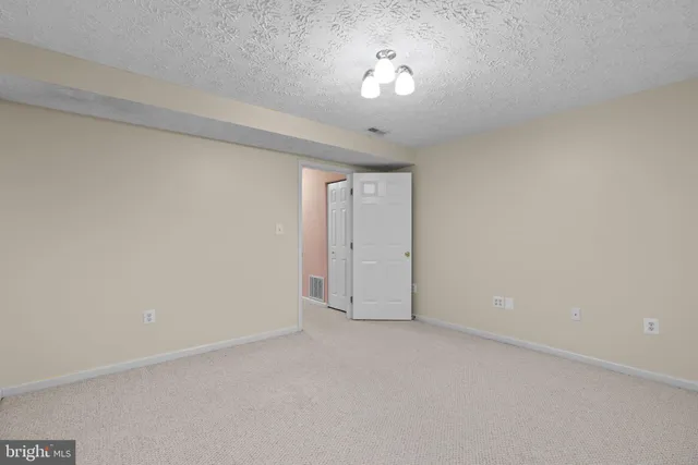 a view of a house with wooden deck