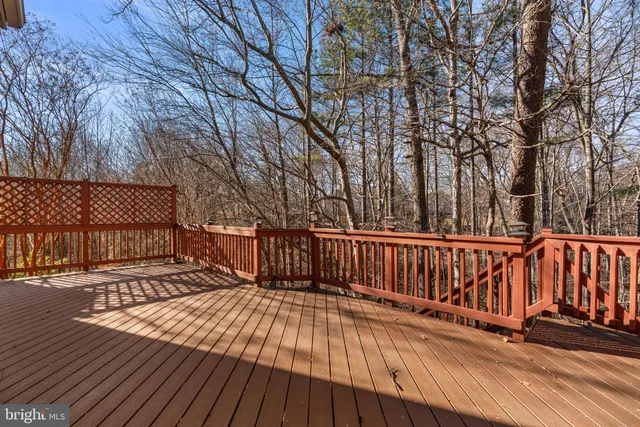 a backyard of a house with barbeque oven table and chairs