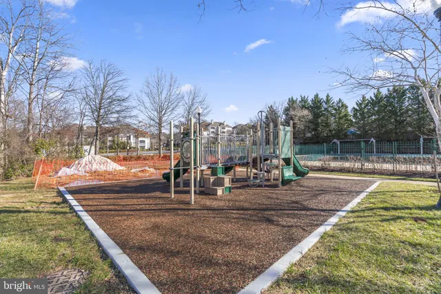 a view of a swimming pool with an outdoor seating and a garden