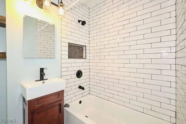 a bathroom with a bathtub and shower