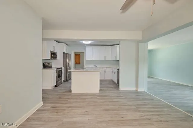 a view of kitchen with wooden floor
