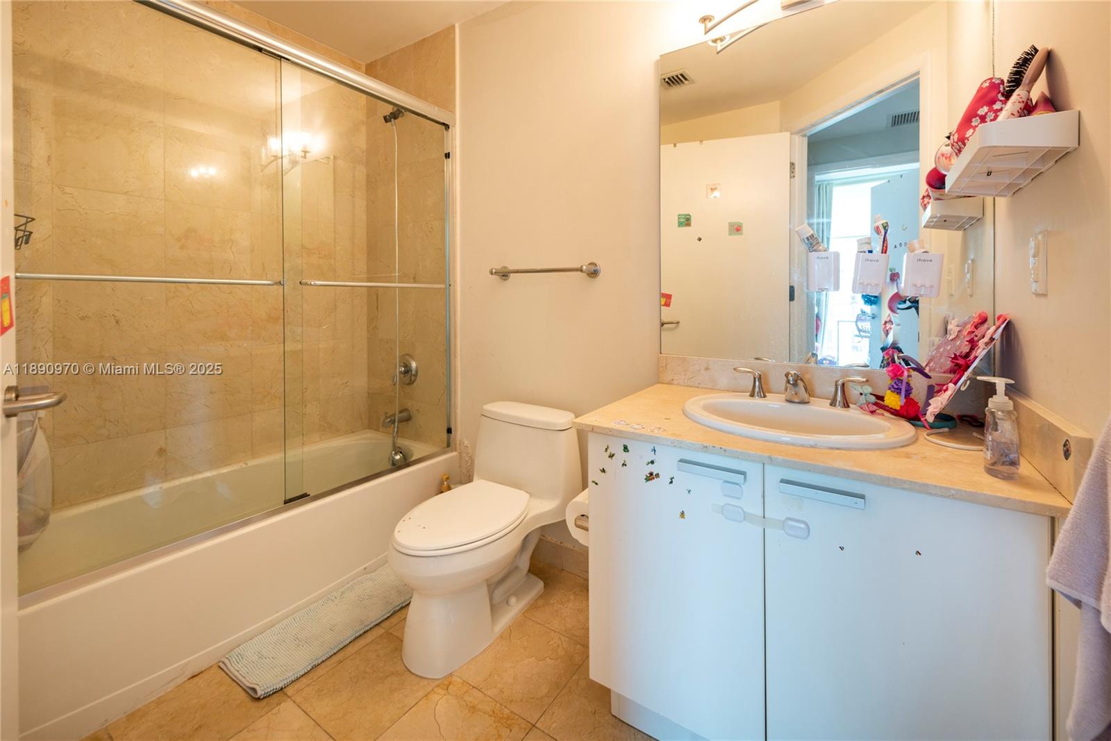 3131 Northeast 188th Street, Unit 2808 Aventura, FL 33180 - Photo 13 of 33 a bathroom with a sink toilet and shower