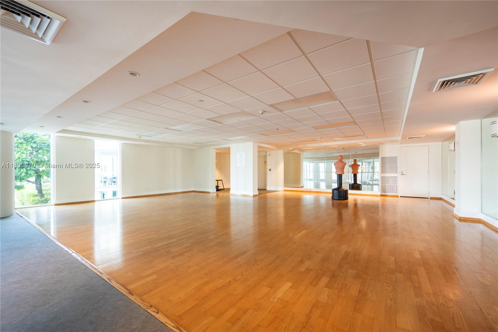 3131 Northeast 188th Street, Unit 2808 Aventura, FL 33180 - Photo 22 of 33 a view of empty room with wooden floor and fan
