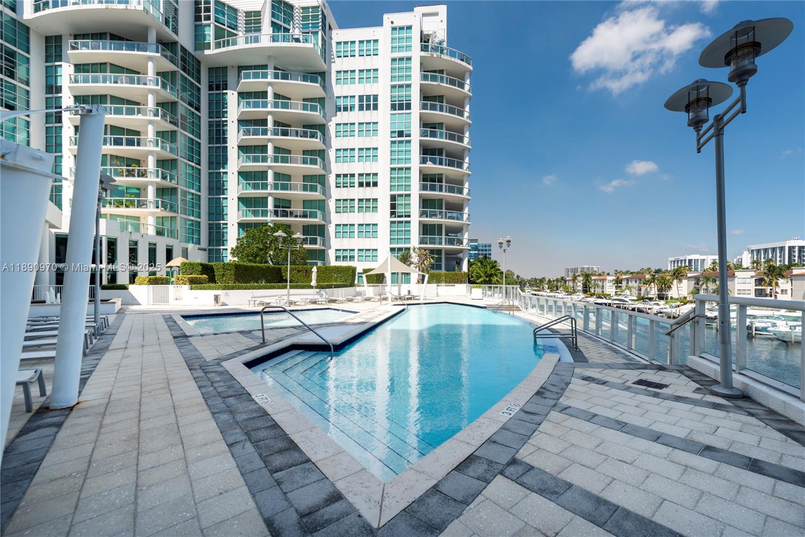 3131 Northeast 188th Street, Unit 2808 Aventura, FL 33180 - Photo 25 of 33 a swimming pool with outdoor seating and yard