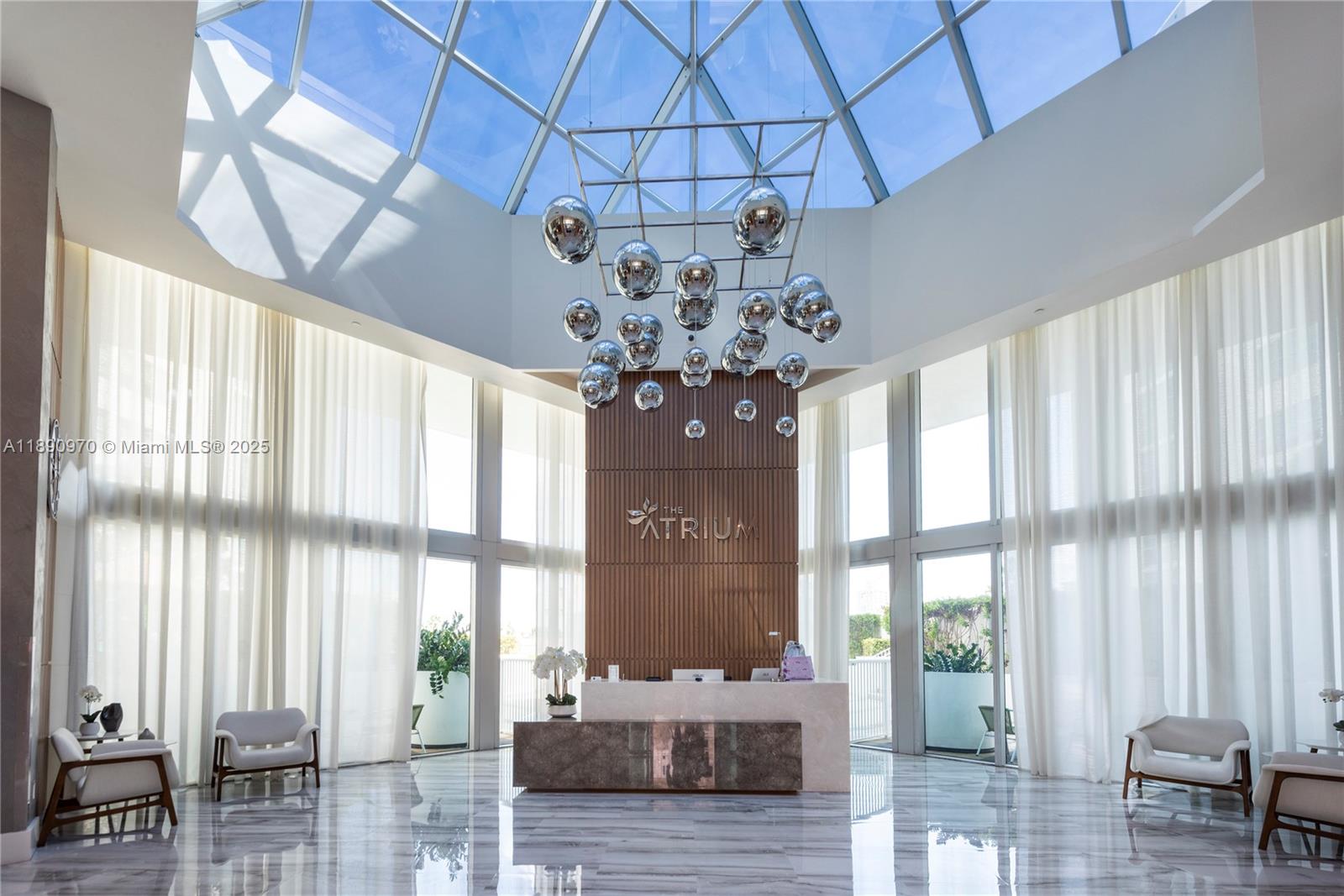 3131 Northeast 188th Street, Unit 2808 Aventura, FL 33180 - Photo 31 of 33 a view of a dining room with furniture and chandelier curtains