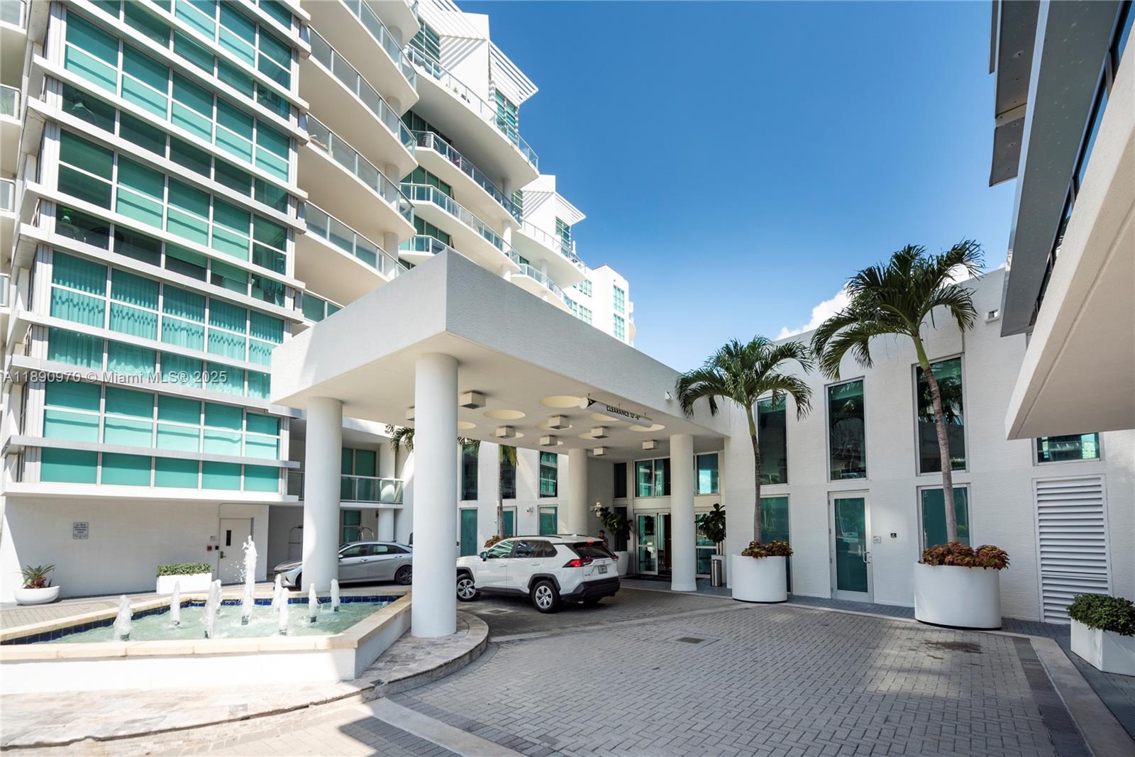 3131 Northeast 188th Street, Unit 2808 Aventura, FL 33180 - Photo 32 of 33 a living room with furniture and a potted plant