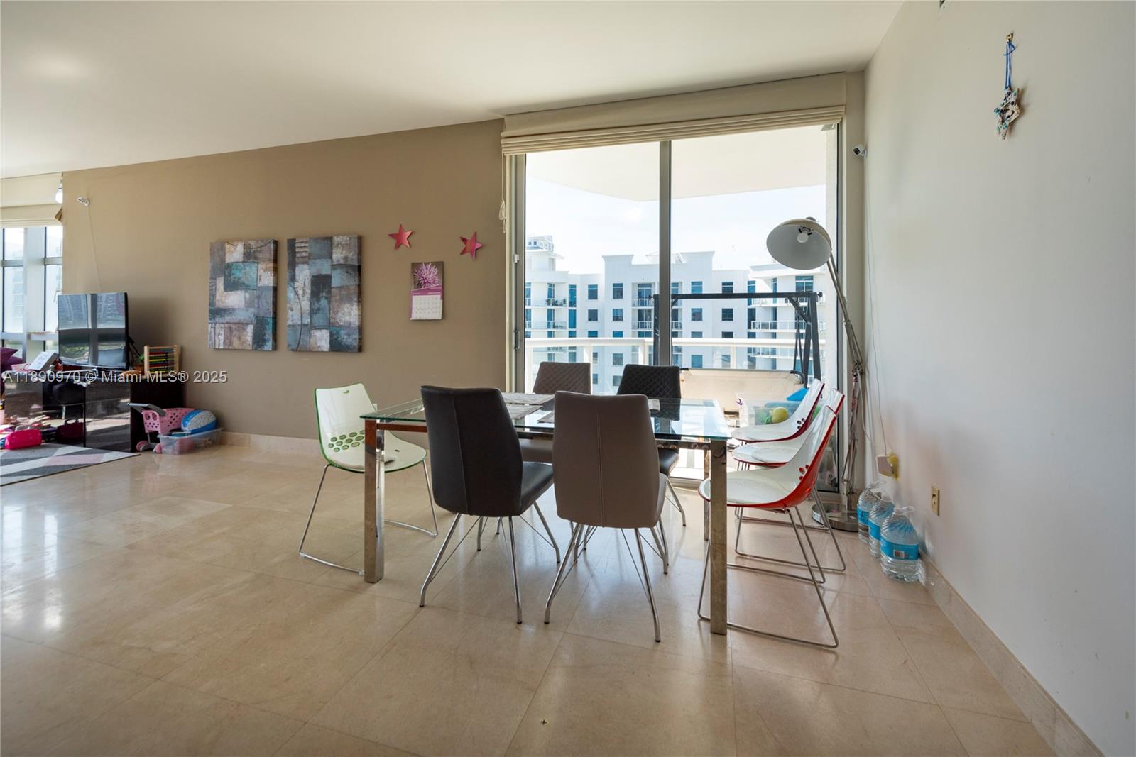 3131 Northeast 188th Street, Unit 2808 Aventura, FL 33180 - Photo 4 of 33 a dining room with furniture and a floor to ceiling window
