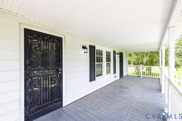 a view of front door with wooden floor