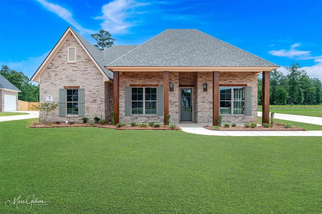 front view of a house with a yard