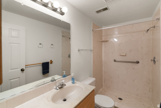 435 Canyon Road Millville, UT 84326 - Photo 45 of 113 Full bathroom featuring a shower with light-toned paneling and a grab bar