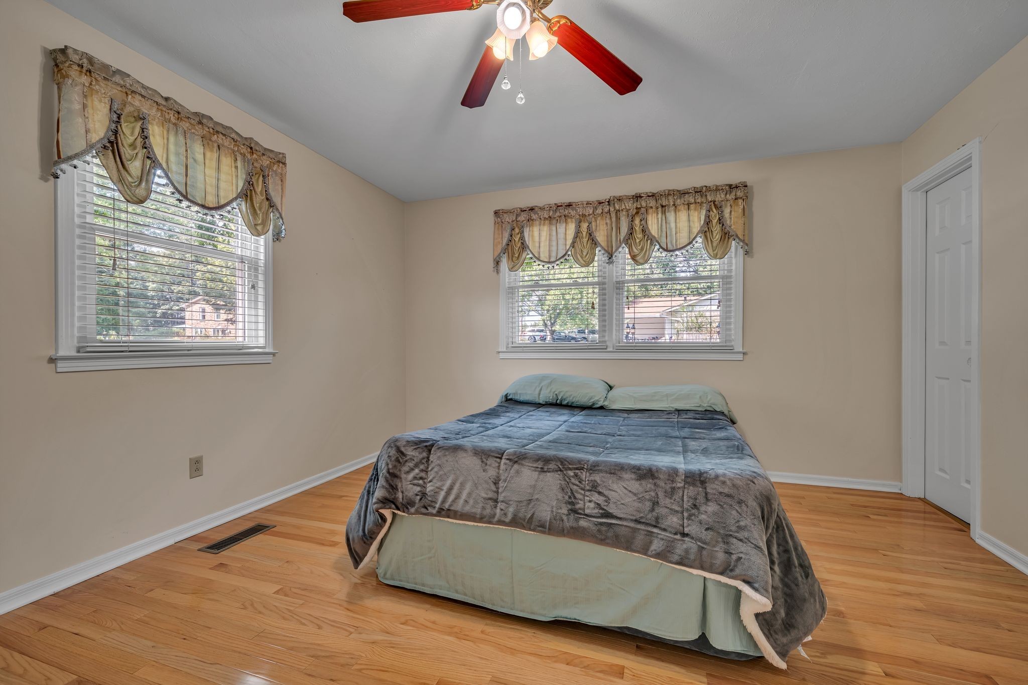 126 Robin Hood Road Dickson, TN 37055 - Photo 12 of 31 a bedroom with a bed and wooden floor