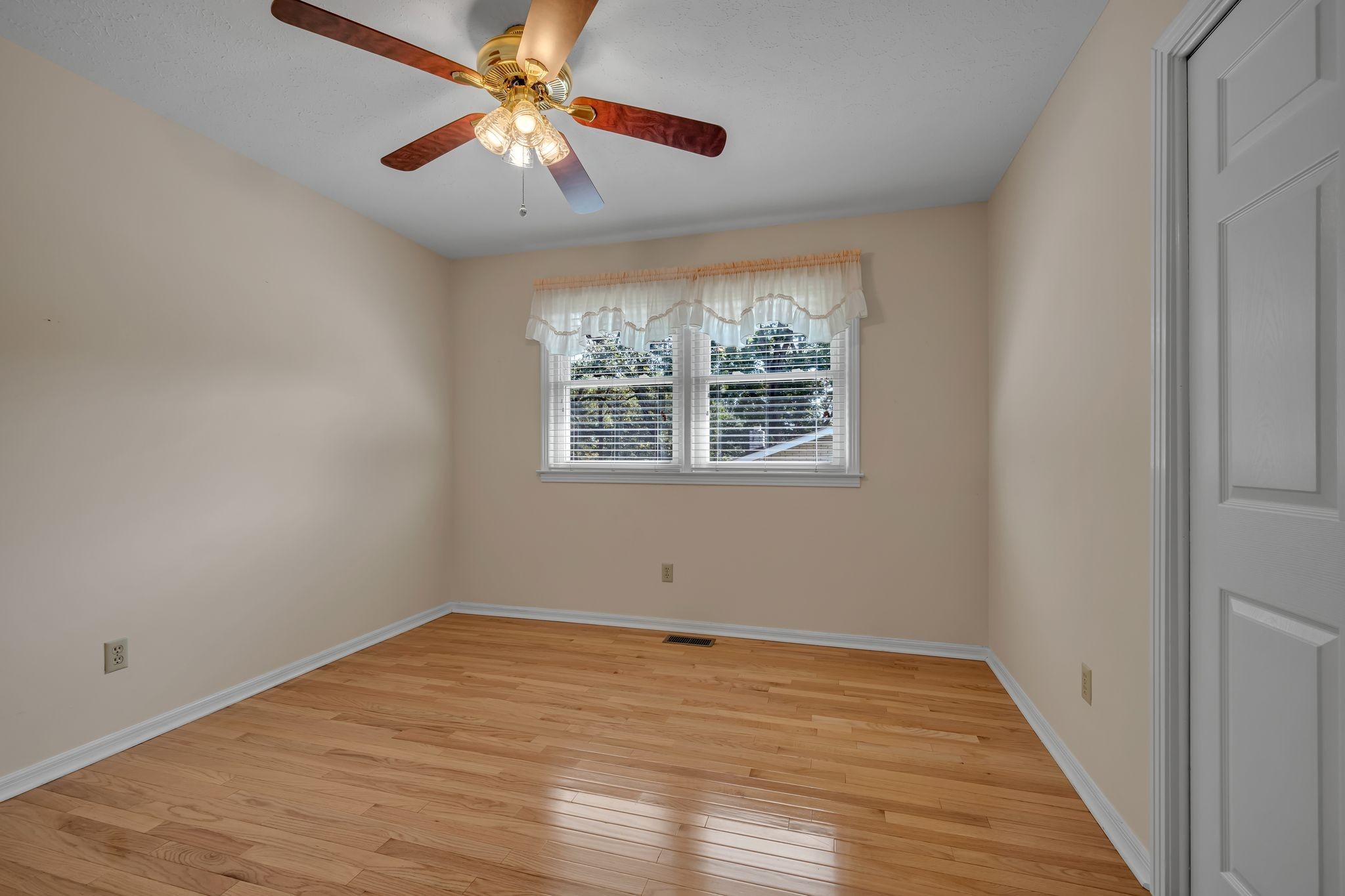 126 Robin Hood Road Dickson, TN 37055 - Photo 26 of 31 a view of empty room with wooden floor and fan