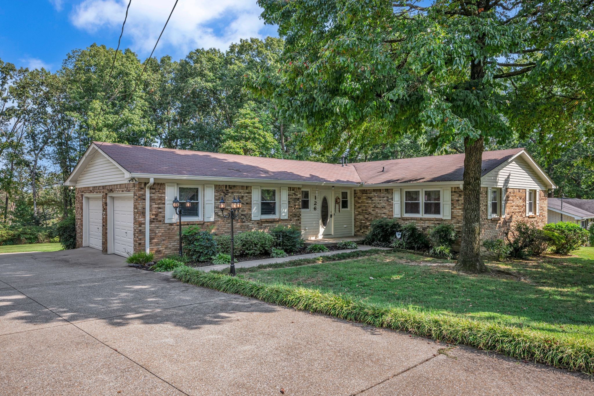 126 Robin Hood Road Dickson, TN 37055 - Photo 3 of 31 a front view of a house with a yard