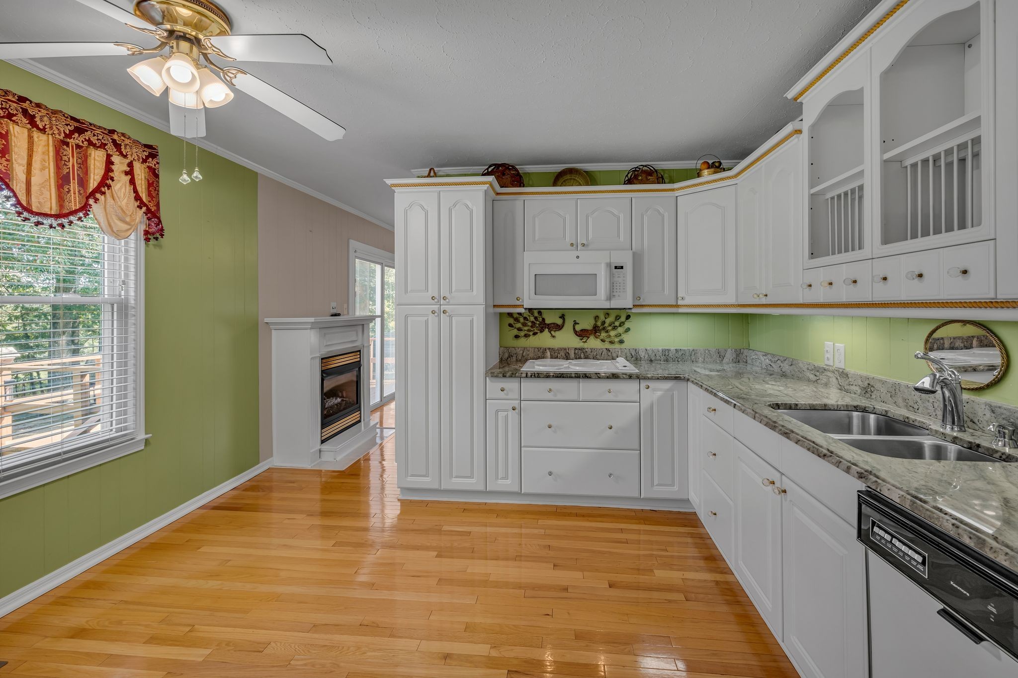 126 Robin Hood Road Dickson, TN 37055 - Photo 8 of 31 a kitchen with a refrigerator and window