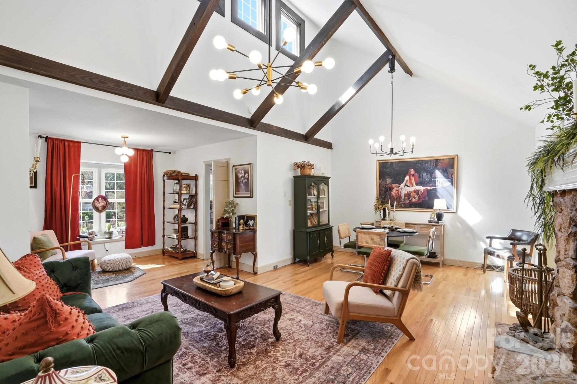6046 Windjammer Drive Tega Cay, SC 29708 - Photo 11 of 46 a living room with furniture and a chandelier